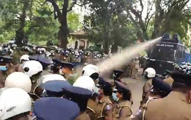 Police Used Tear Gas Water Cannon To Disperse Jvp March Sangathy 7097